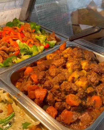 Sunday buffet trays of curries and stir fries