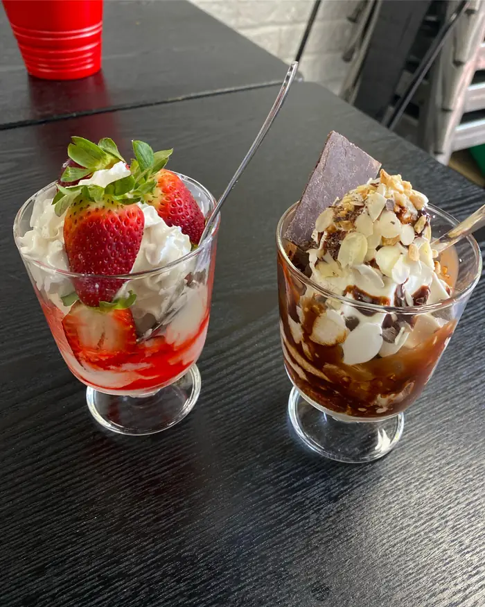 Strawberries and cream and choccie nut soft serve sundaes